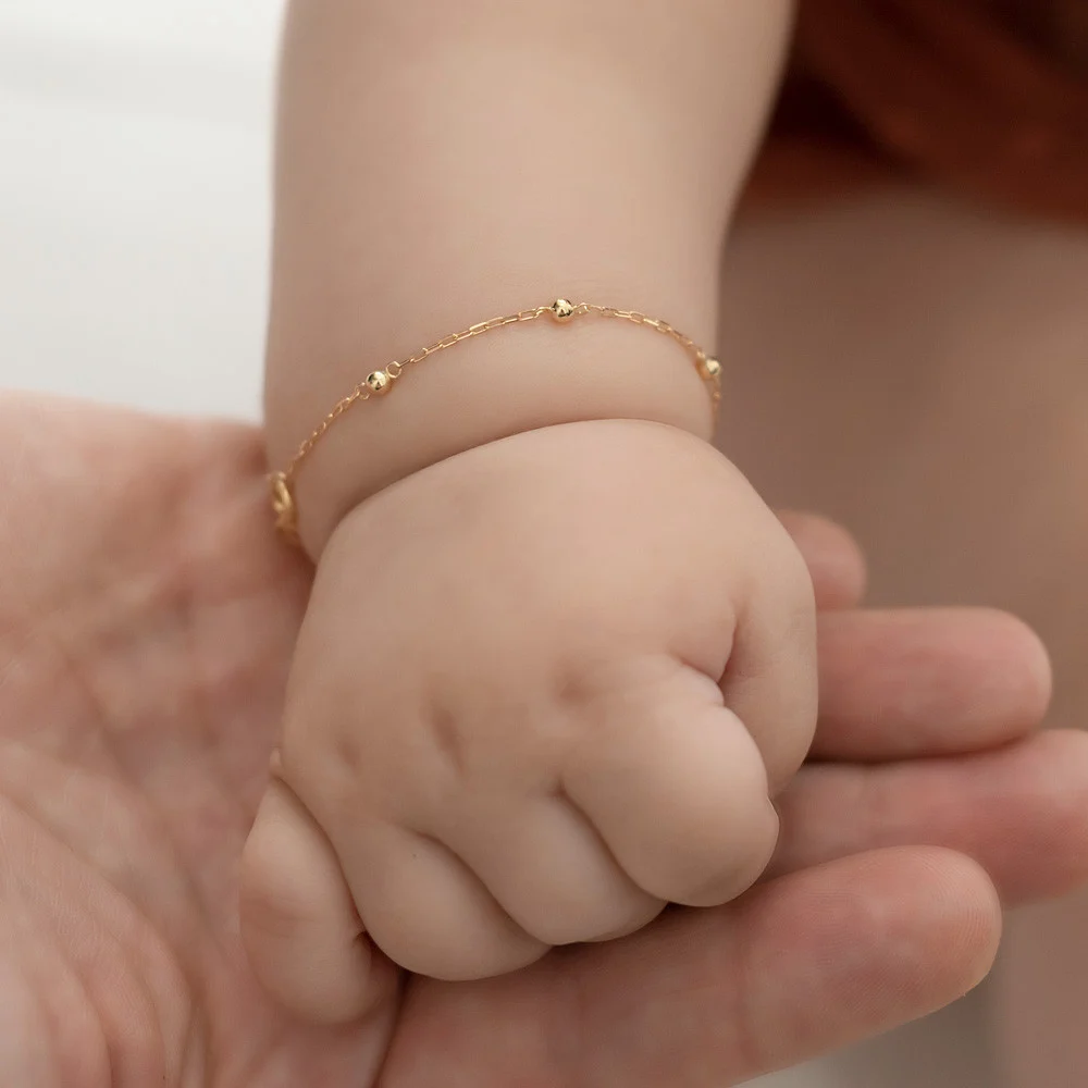 Pulseira bolinha de ouro delicada