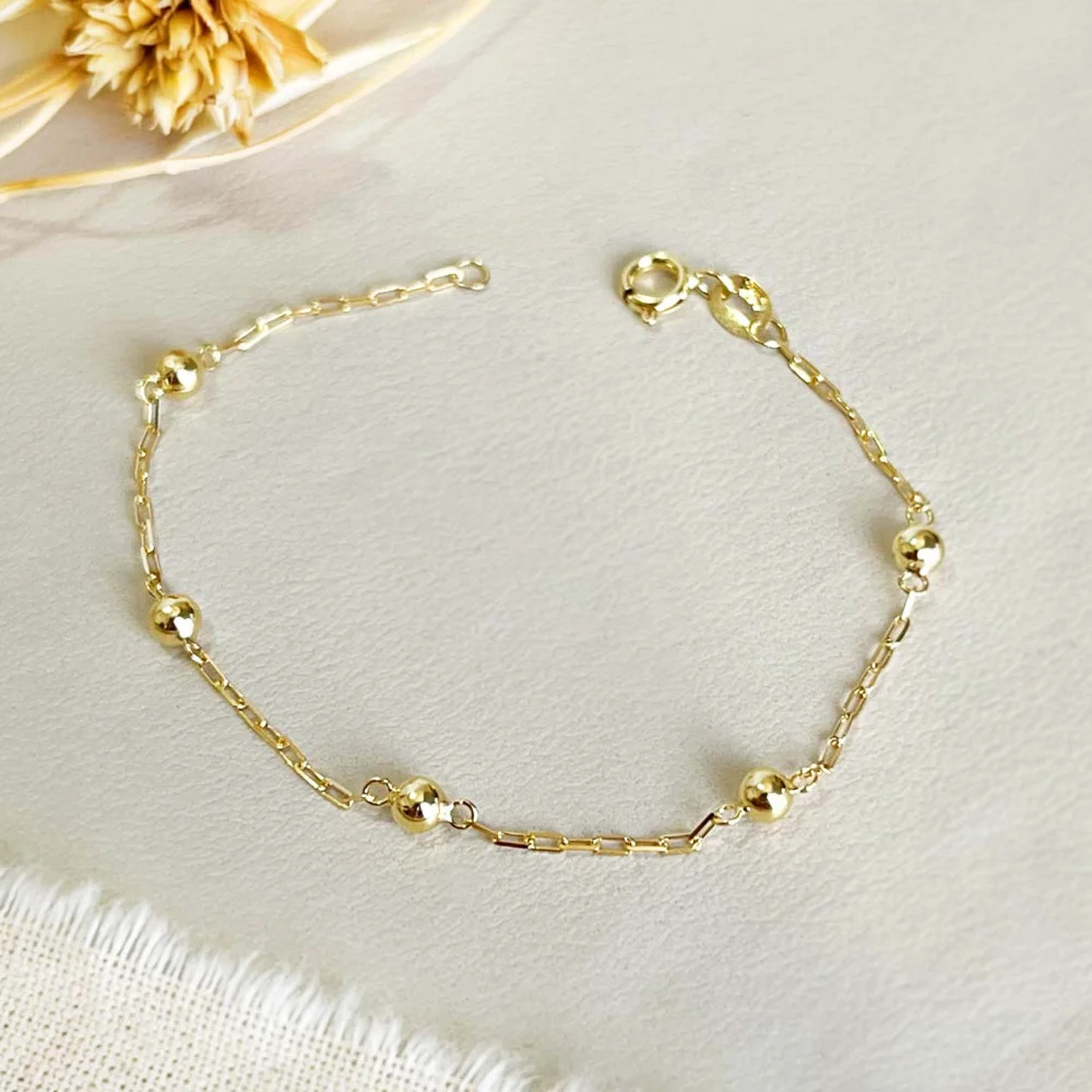 Pulseira bolinha de ouro infantil